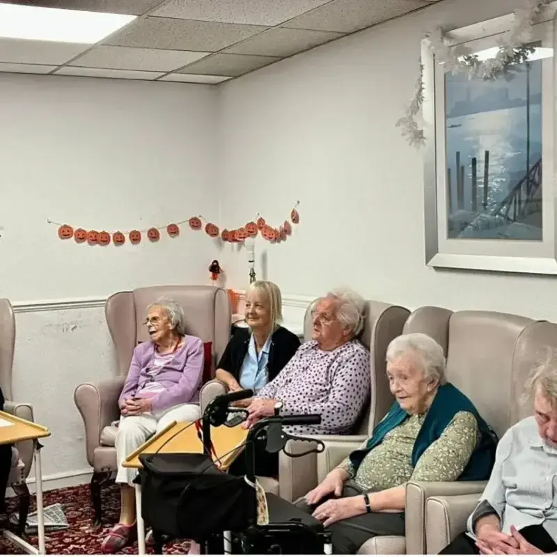 residents together in lounge area on chairs