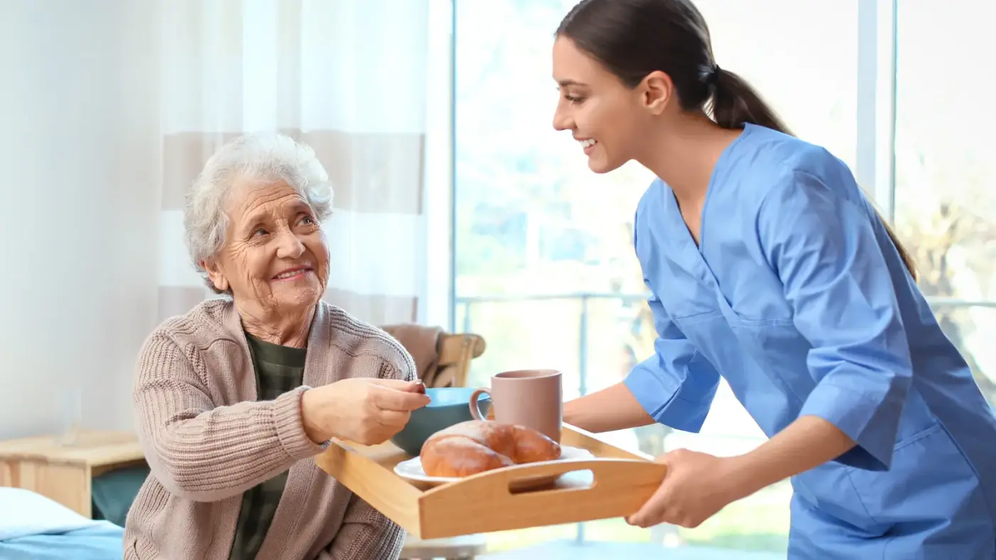 carer bring resident breakfast and tea