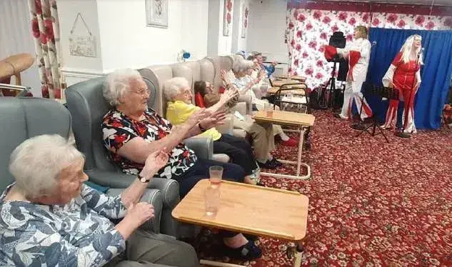 elderly residents having fun in lounge area