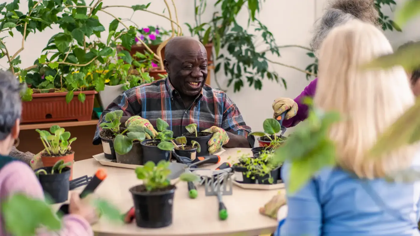 care home residents enjoying gardening activity